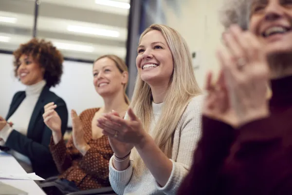 Businesswomen Applauding Presentation