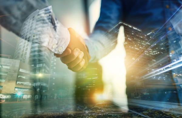 Digital, city or deal with business people shaking hands in agreement, promotion or b2b partnership. Overlay, handshake and thank you with a man employee in an urbane town to welcome a colleague