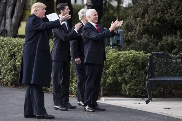 President Donald Trump and other Republicans celebrate the passage of the tax bill in December 2017. (Zach Gibson/Bloomberg)