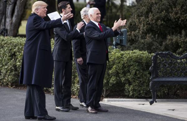 President Donald Trump and other Republicans celebrate the passage of the tax bill in December 2017. (Zach Gibson/Bloomberg)