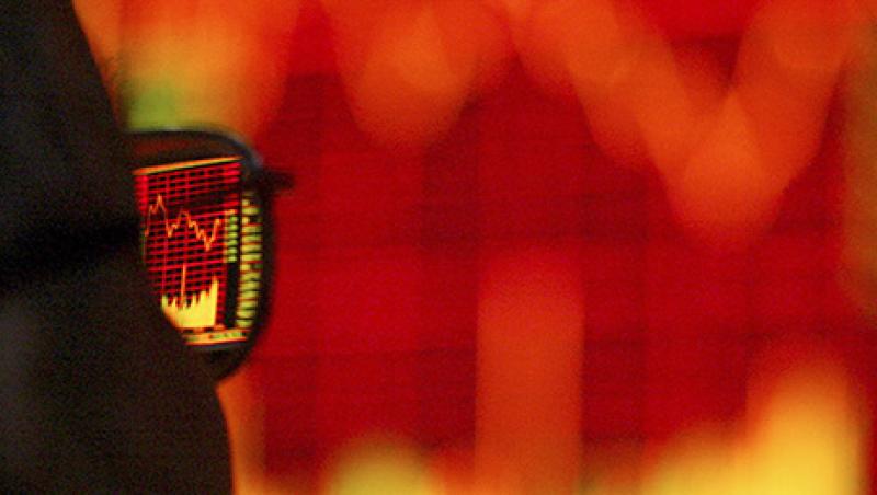 A Chinese customer walks pass the stock index at the end of the trading day in a stock trade floor in Shanghai, China on 26 April, 2004. A Chinese customer walks pass the stock index at the end of the trading day in a stock trade floor in Shanghai, China on 26 April, 2004.