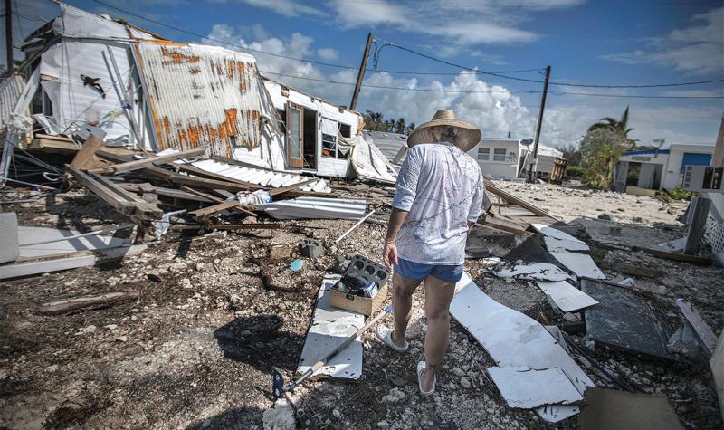 Photographs by Kadir van Lohuizen / NOOR / Redux. Sharon Noeller walks through Sea Breeze RV Park on Plantation Key after Hurricane Irma. She had lived there for 12 years. Photographs by Kadir van Lohuizen / NOOR / Redux. Sharon Noeller walks through Sea Breeze RV Park on Plantation Key after Hurricane Irma. She had lived there for 12 years.