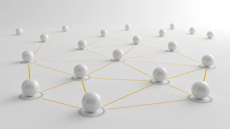 Multiple white spheres connected by thin yellow lines in a network pattern.