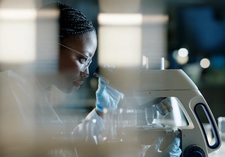 Scientist with microscope