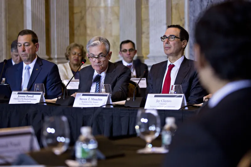 Joseph Otting, Jerome Powell, and Steven Mnuchin at the Financial Stability Oversight Council meeting. (Andrew Harrer/Bloomberg)