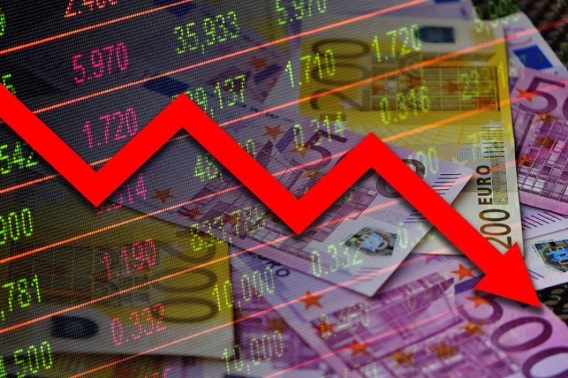 Economy graph: red down arrow, cash euro banknotes and stock exchange board