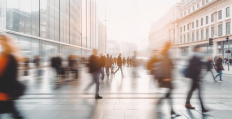 Beautiful motion blur of people walking in the morning rush hour, busy modern life concept. Suitable for web and magazine layouts.
