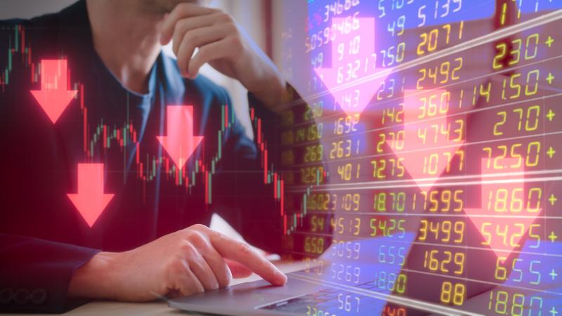 Investment financial property trading in down trend Businessman using computer working on virtual trading price and graph with arrow are pointing down Investment financial property trading in down trend Businessman using computer working on virtual trading price and graph with arrow are pointing down