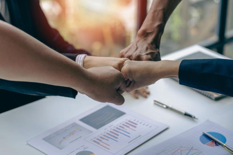 Successful colleagues put their naughty hands with fists together in the financial business idea office. Successful colleagues put their naughty hands with fists together in the financial business idea office.