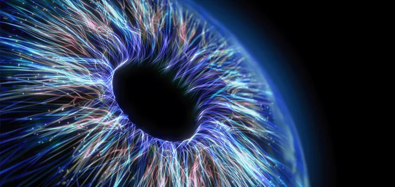 Flowing blue digital lines create an abstract human eye, suggesting technology- enhanced analysis and insight.